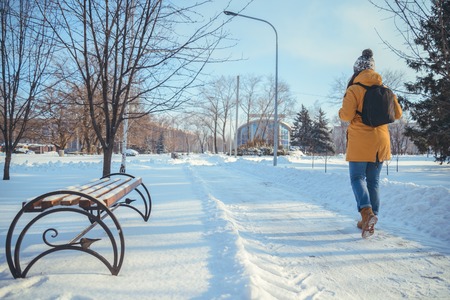 woman walking in winter parkの写真素材