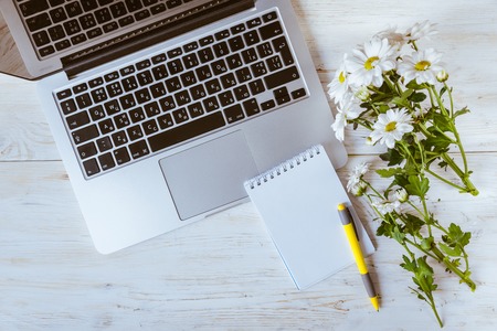 work office desk with computer laptop, notebook, penの写真素材