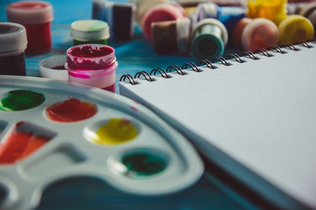 Paper, watercolors, paint brush and some art stuffの写真素材