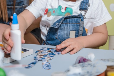 mother with kid paint eggsの写真素材