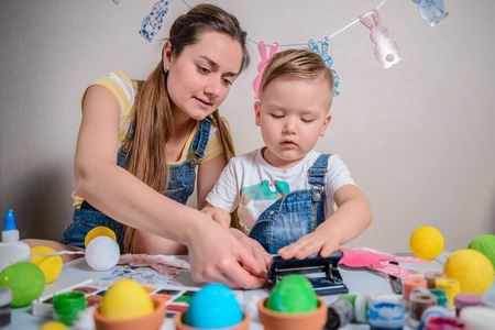 Mother teaches kid to do craft itemsの写真素材