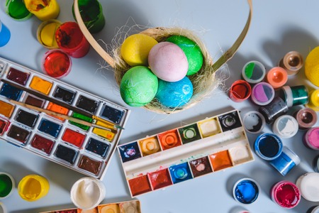 paint colored eggs on the white boardの写真素材