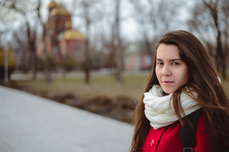 Portrait of young pretty woman in cold spring dayの写真素材