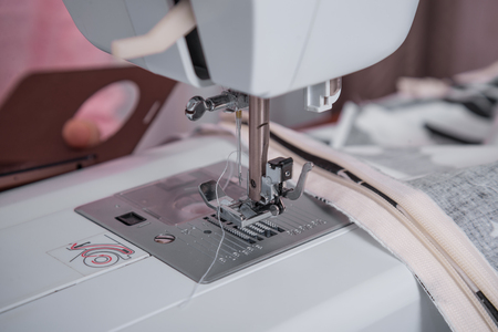 sewing machine and item of clothing close upの写真素材