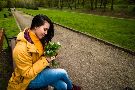 Young happy woman happy smiling enjoying spring summer dayの写真素材