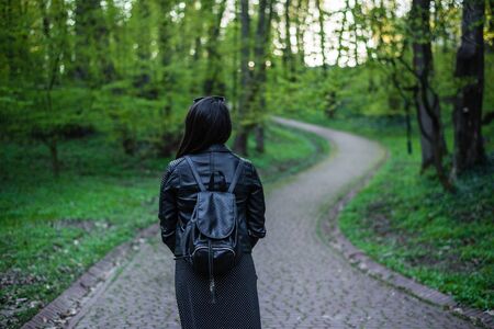 woman walking by park