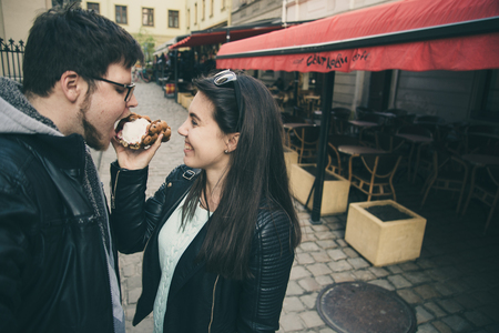 woman feed man with icecreamの写真素材
