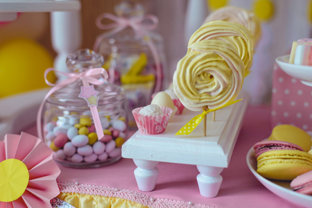 table with candies, macaroonsの写真素材