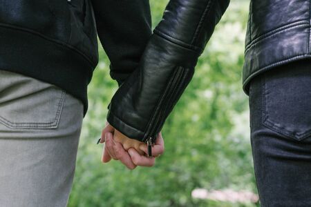 Closeup of loving couple holding hands