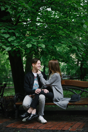 young couple  sit on the benchの写真素材