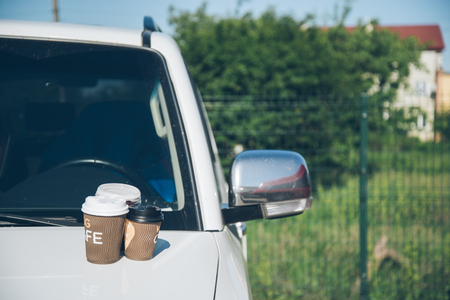 3 Cups of coffee on car hoodの写真素材