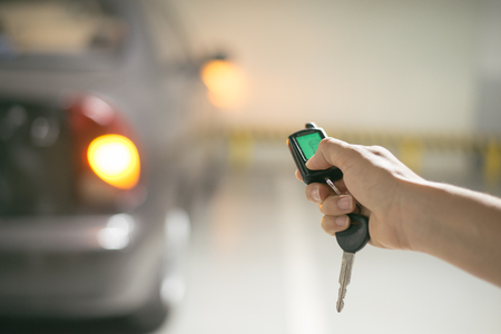 hand presses on the remote control car alarm systemsの写真素材