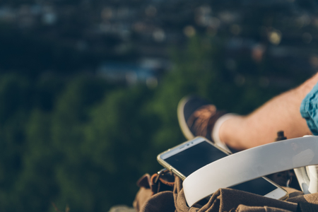man sits on the ground chating on the phoneの写真素材