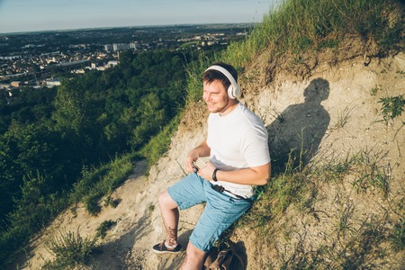 man listen music on the peak of the hillの写真素材