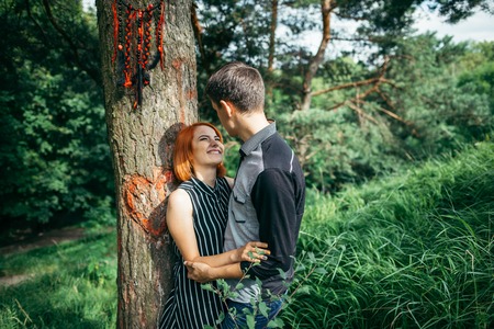 Love couple kissing under a treeの写真素材