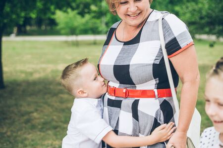 Grandmother playing in the park with grandchildren
