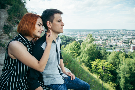 couple holding hands and looking at the panorama of Lviv, Ukraineの写真素材