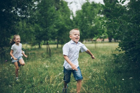 Two Little Kids Running in the pakの写真素材
