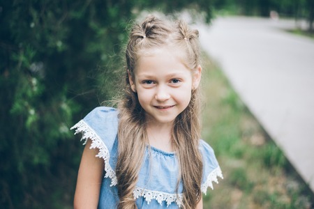 Cute little girl in summer parkの写真素材