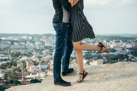 woman hugs man on the peak of the mountainの写真素材