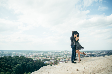 woman hugs man on the peak of the mountainの写真素材