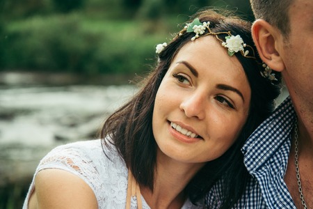 woman put had on mans shoulderの写真素材