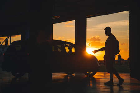 parking place with car man walks to carの写真素材