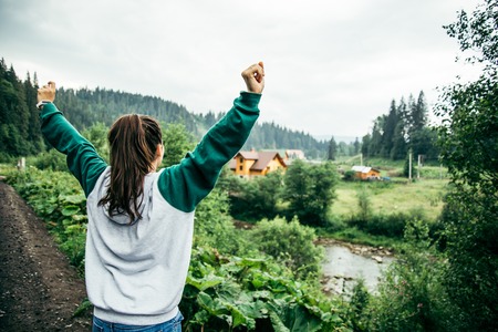 young happy woman rejoices view