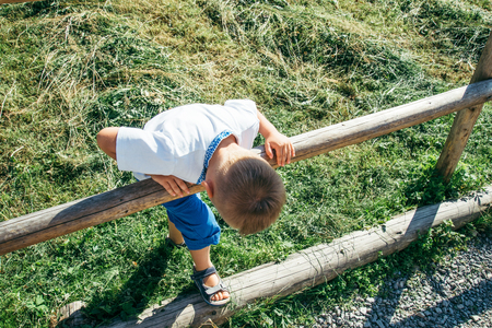 little kid playing around on farmの写真素材