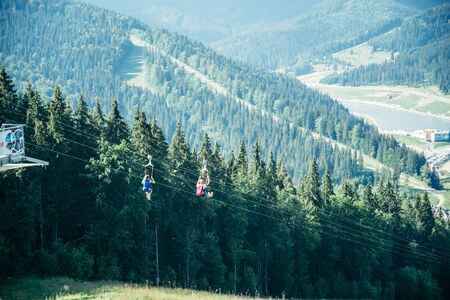 Man zipline flight in moutainsの写真素材