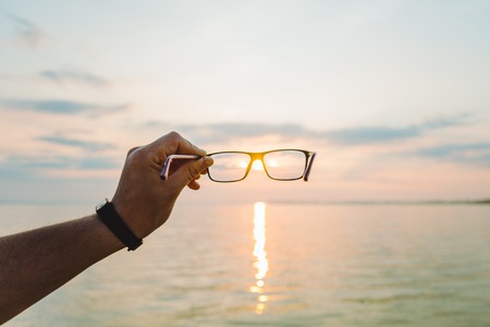 sunrise through eyeglassesの写真素材