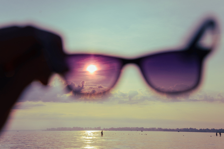 sunrise through sunglassesの写真素材