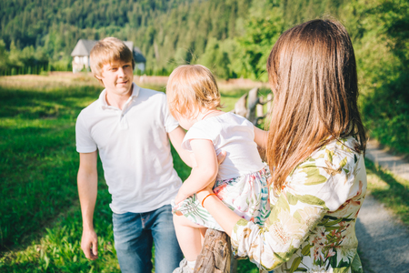 parents play with their daughterの写真素材
