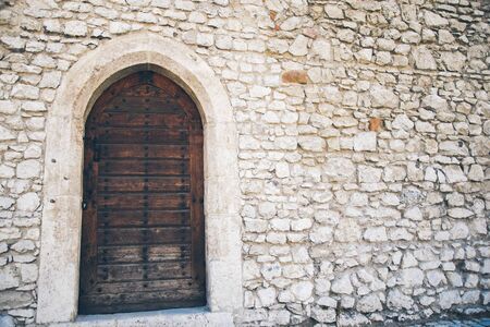 house white wall with brown doorの写真素材