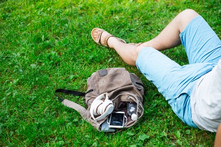 backpack with water, mobile phone and powerbank insideの写真素材