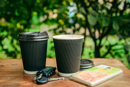 two cups of coffee on the wooden tableの写真素材