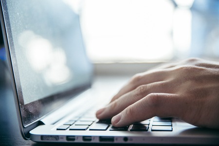 hands close up on laptopの写真素材