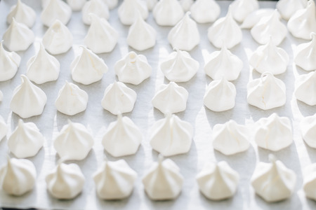 home made meringues on Baking tray close upの写真素材