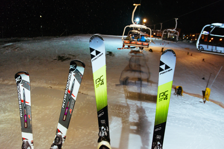 Ukraine, bukovel - December 16, 2017: people with ski on the lift in the eveningのeditorial素材