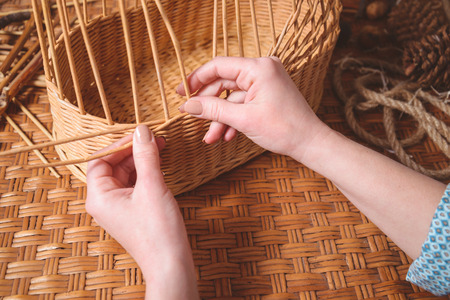 Young pretty woman making baskets, home businessの写真素材