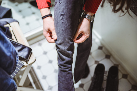 woman try on pants in dressing roomの写真素材