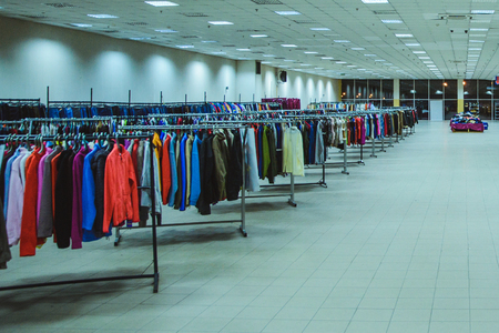 large hall of clothes on in the storeの写真素材