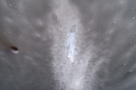 design concept. texture of soap drops on glassの写真素材