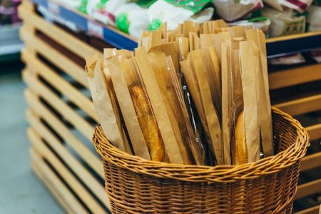 basket with baguette in store. grocery shopping conceptの写真素材