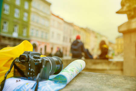 travel concept. camera on the map with blurred town on backgroundの写真素材