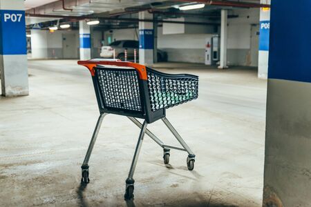 empty trolley at underground parking. shopping concept. copy spaceの写真素材