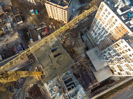 birds eye view on contraction site with craneの写真素材