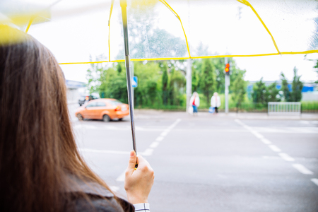 woman with transparent umbrella. rainy weather.の写真素材