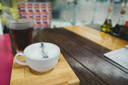 cheese cream soup close up on wooden cafe tableの写真素材