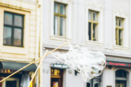 soap bubbles in the center of old european city. having funの写真素材